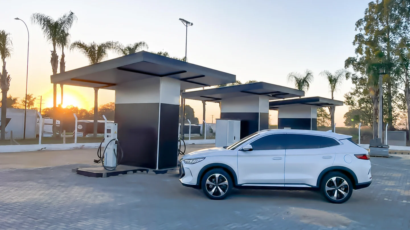 Electric vehicle at a multi-bay overseas charging site